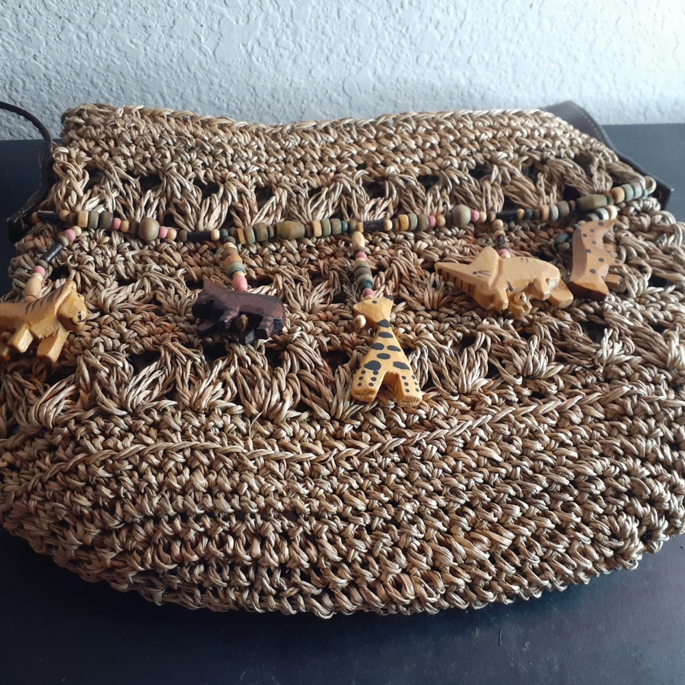 Cappelli Italy Straw Boho Chic 10" Tassled Wood Animal Figurine Crossbody Bag.